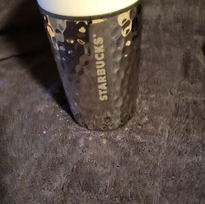 Starbucks ceramic travel cup.